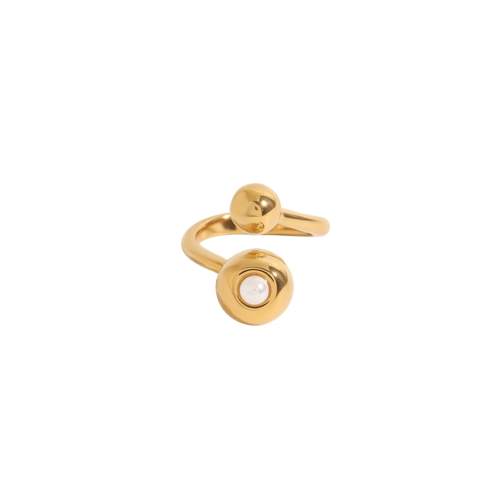 Gold open band ring with pearl accent on one end and a sphere on the other