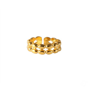 Gold lattice link ring with open adjustable design on plain white background.